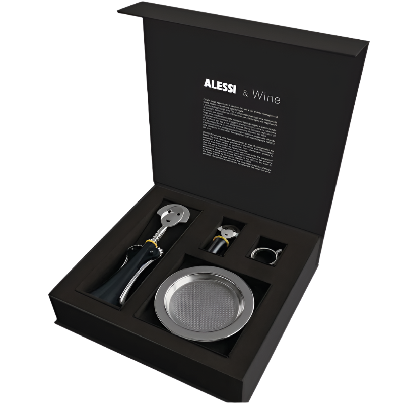 Alessi Wein-Set Verpackung offen Set besteht aus "Anna G." Korkenzieher aus thermoplastischem Harz und verchromtem Zamak "Anna Stop 2" Flaschenverschluß aus thermoplastischem Harz "Noe" Tropfring aus Edelstahl 18/10 "Flaschenuntersetzer" aus Edelstahl 18/10